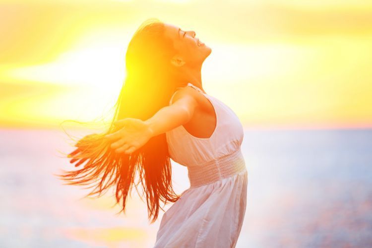 Enjoyment - free happy woman enjoying sunset