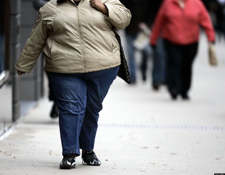 A women walks down the street on Michiga