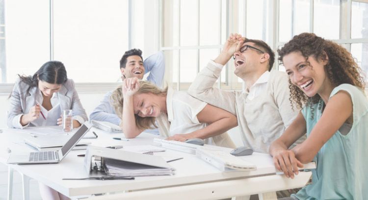 Casual business team laughing during meeting