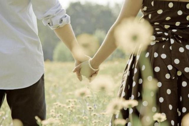 couple in love holding hands together