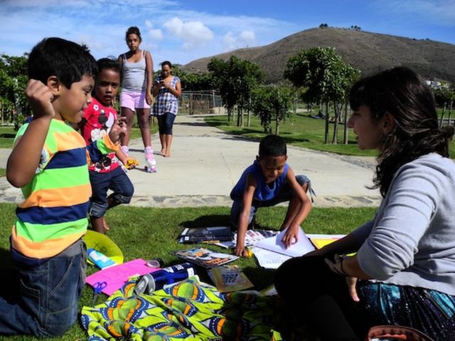 A woman teaching kids