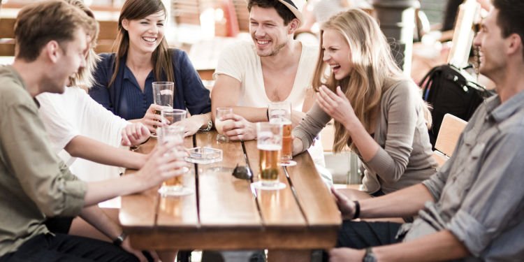 Young people drinking beer outdoors