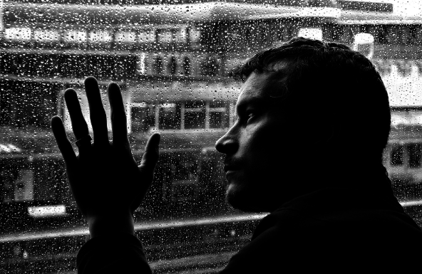 Sad man and rain