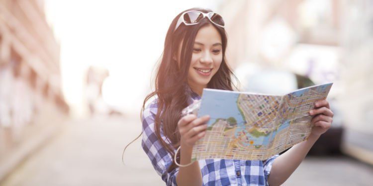 Chinese woman looking at map