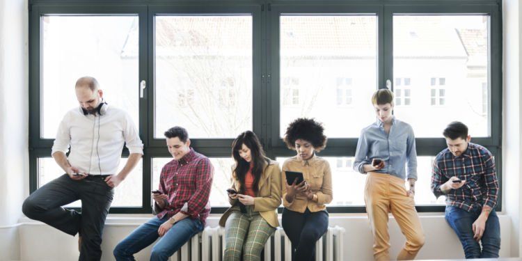 Group Of Young Business People With Smart Phones