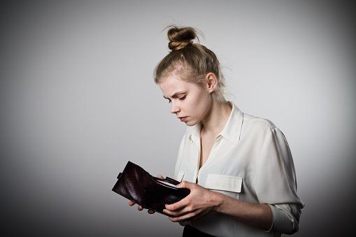 Woman and empty wallet