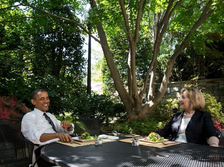 President Obama has lunch with former Secretary of State Hillary Clinton on the patio outside the Oval Office on Monday.