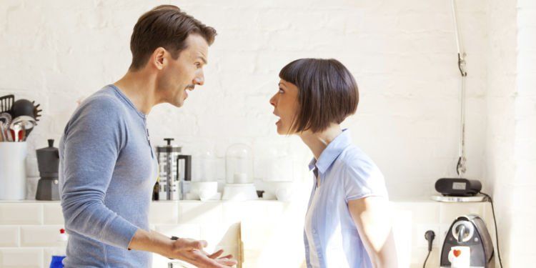 Couple having a discussion in the kitchen