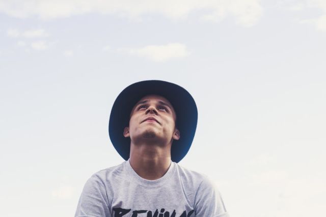 man-in-white-and-black-crew-neck-shirt-and-hat