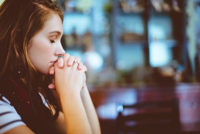 woman-sincerely-praying-in-focus-photography