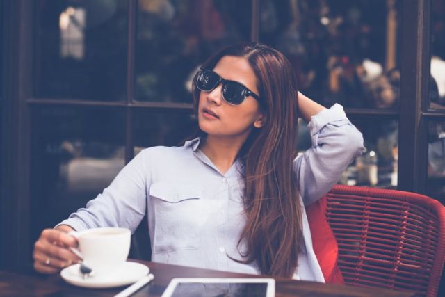 portrait-of-young-woman-drinking-coffee-at-home