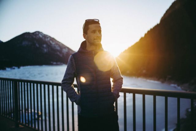 adult-backlit-beach-bridge