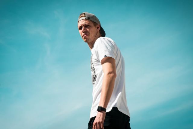 man-in-white-crew-neck-shirt-under-clear-blue-skies