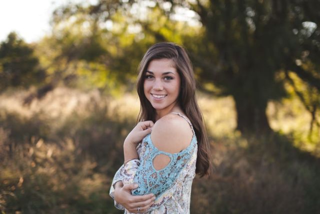 woman-in-blue-white-cold-shoulder-shirt