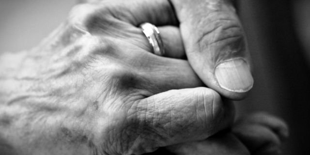 Old Couple Holding Hands