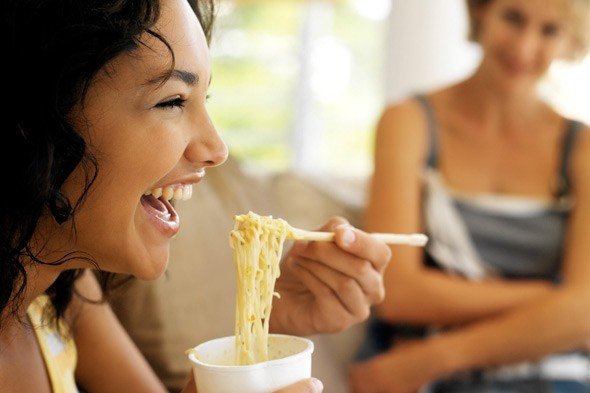 Woman eating noodles