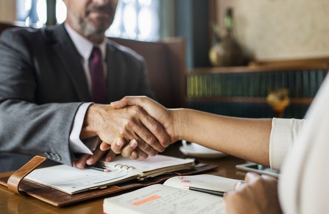 https://www.pexels.com/photo/people-shaking-hands-1056553/