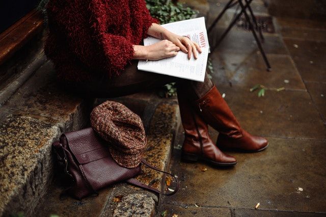 https://www.pexels.com/photo/woman-sitting-while-holding-book-1440896/