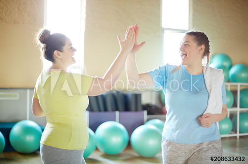 Two oversized girl doing sport