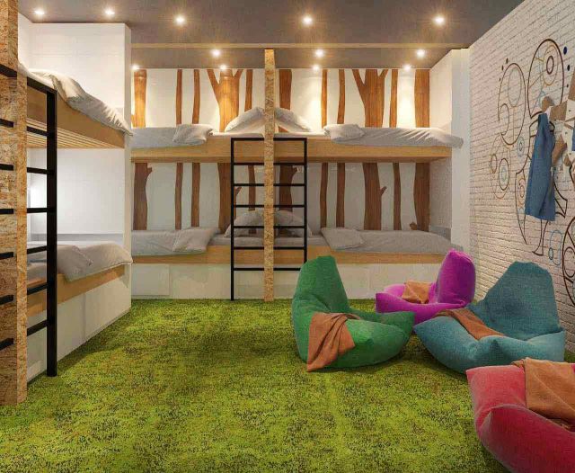 Desain game room yang menyatu dengan kamar tidur project B Hostel oleh Design Intervention