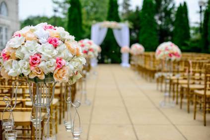 Photo by selective focus photography white and pink isle flower arrangement