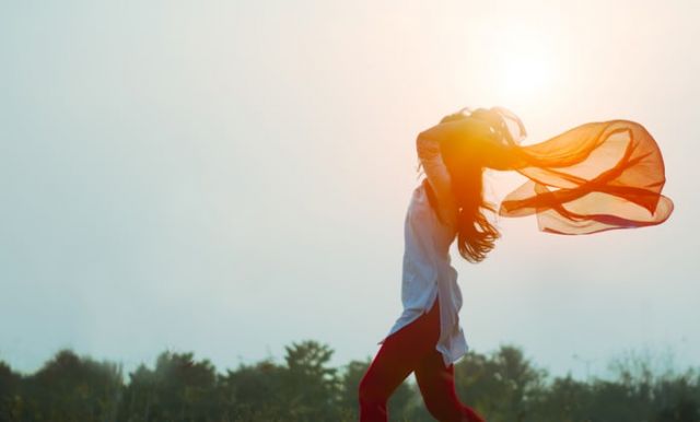 Woman spreading hair at during sunset by Aditya Saxena