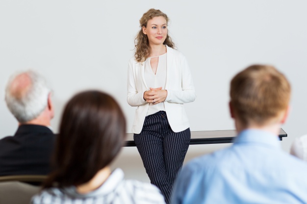 Woman Giving a Lecture to Audience 