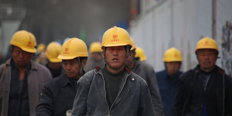 Grup of Person Wearing Yellow Safety Helmet During Daytime