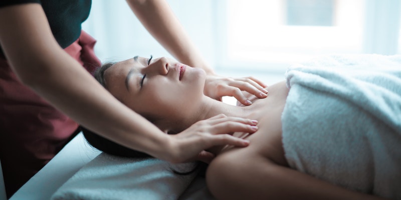 Selective Focus Photo of Women Getting a Massage