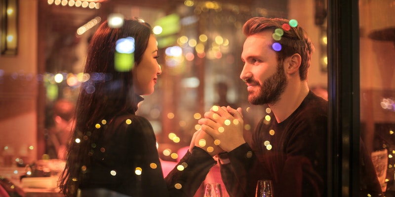 Photography of couple holding hands