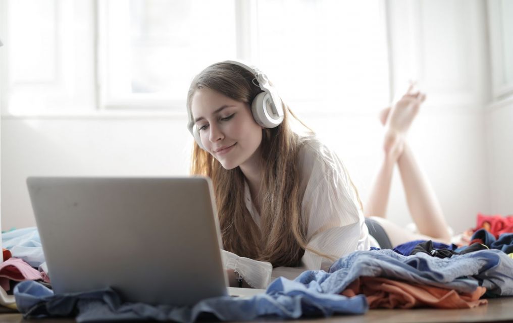 A Women with Headphone and leptop